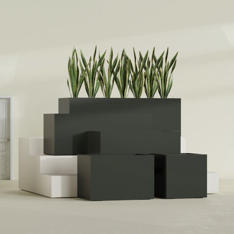 Granada fiberglass planter in Matte Charcoal, size range, in a sunlit interior