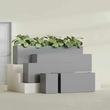 Miami Corner fiberglass planter in Matte Gunmetal, size range, in a sunlit interior