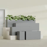 Miami Narrow Rectangular fiberglass planter in Matte Gunmetal, size range, in a sunlit interior