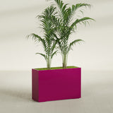 Potsdam Corner fiberglass planter in Gloss Eggplant, shown planted, in a sunlit interior