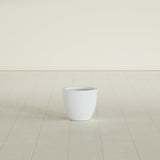 Wannsee Round Planter in Gloss Bright White, 15"D × 13"H, shown empty