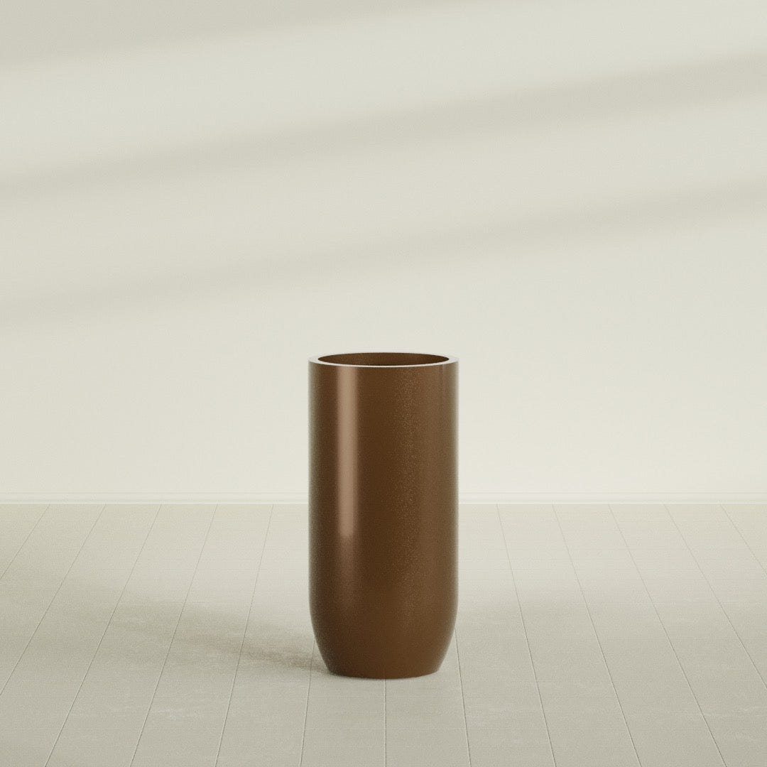 Saint Tropez Bullet Round Planter in Metallic Bronze, 24"D × 50"H, shown empty