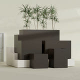 Brisbane Corner fiberglass planter in Matte Dark Brown, size range, in a sunlit interior