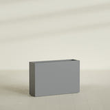 Milano Narrow Rectangular Planter in Matte Gunmetal, 36"L × 10"D × 24"H, shown empty