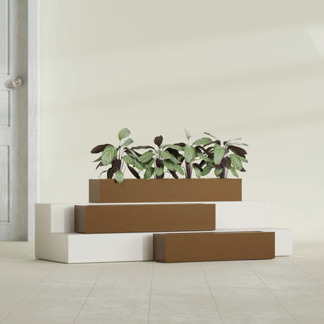 Salon Box fiberglass planter in Metallic Bronze, size range, in a sunlit interior