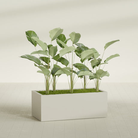 Torino Corner fiberglass planter in Satin Beige, shown planted, in a sunlit interior
