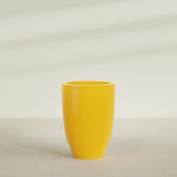 Brannan Tapered Round Planter in Gloss Saffron, 30"D × 41"H, shown empty