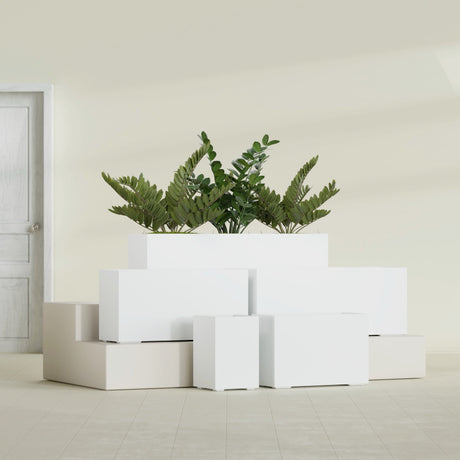 Tolga Corner fiberglass planter in Matte Bright White, size range, in a sunlit interior