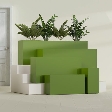 Hollywood Corner fiberglass planter in Satin Green, size range, in a sunlit interior