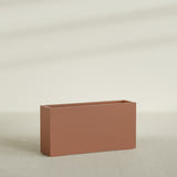 Hollywood Narrow Rectangular Planter in Matte Terra Cotta, 48"L × 12"D × 24"H, shown empty
