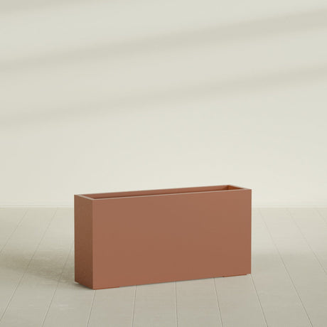 Hollywood Narrow Rectangular Planter in Matte Terra Cotta, 48"L × 12"D × 24"H, shown empty