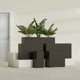 Potsdam Corner fiberglass planter in Matte Dark Brown, size range, in a sunlit interior