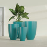Brannan Tapered Round fiberglass planter in Satin Seafoam Green, size range, in a sunlit interior