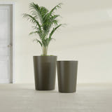 Tegel Round Tapered fiberglass planter in Matte Bronze, size range, in a sunlit interior
