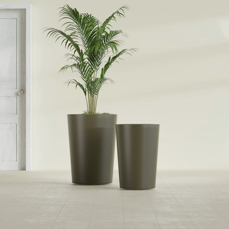 Tegel Round Tapered fiberglass planter in Matte Bronze, size range, in a sunlit interior