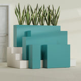 Delray Corner fiberglass planter in Satin Seafoam Green, size range, in a sunlit interior