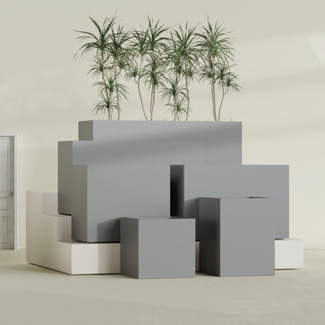 Brisbane Corner fiberglass planter in Matte Gunmetal, size range, in a sunlit interior
