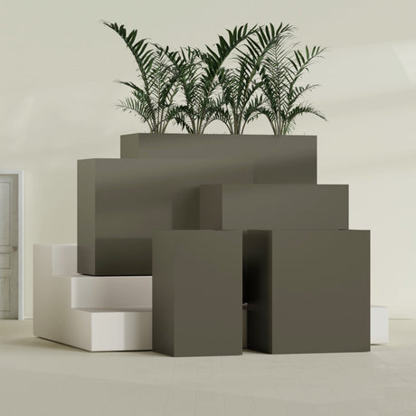 Darwin Corner fiberglass planter in Matte Bronze, size range, in a sunlit interior