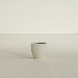 Wannsee Round Planter in Satin Beige, 15"D × 13"H, shown empty