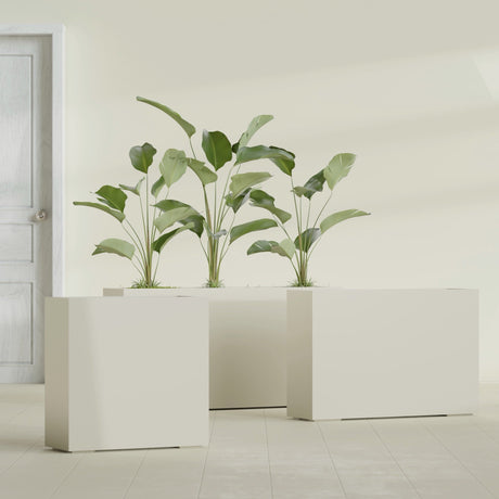 Milano Narrow Rectangular fiberglass planter in Satin Beige, shown planted, in a sunlit interior