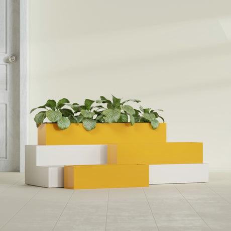 Monaco Rectangle fiberglass planter in Gloss Saffron, shown planted, in a sunlit interior