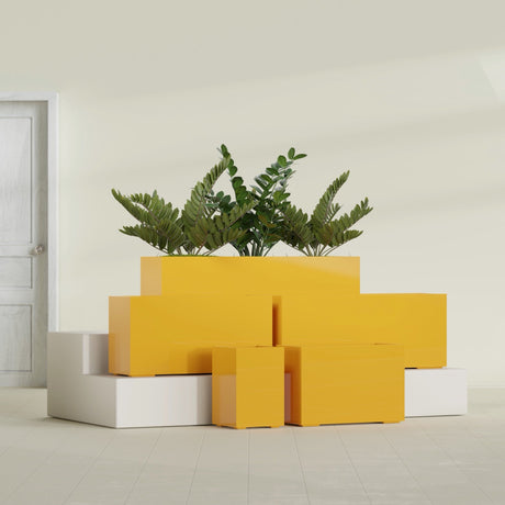 Tolga Corner fiberglass planter in Gloss Saffron, size range, in a sunlit interior