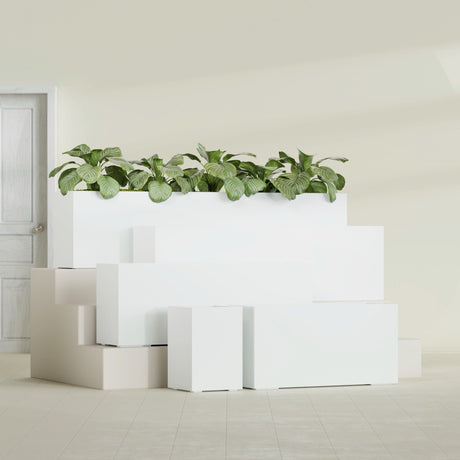 Miami Corner fiberglass planter in Gloss Bright White, size range, in a sunlit interior
