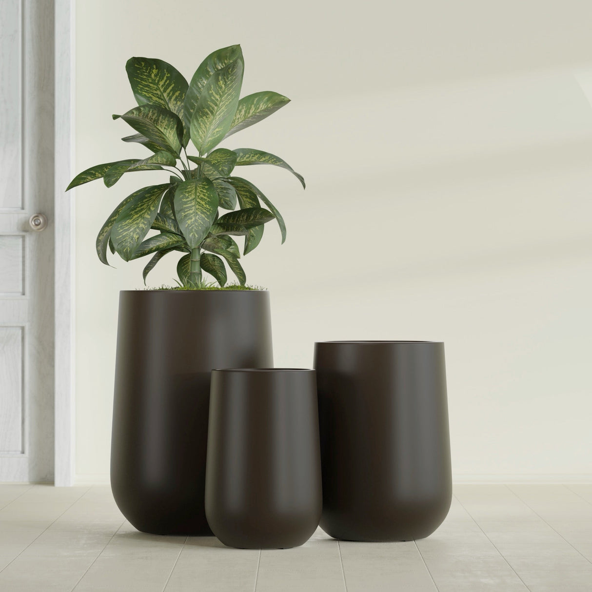 Hayden Urn fiberglass planter in Matte Dark Brown, size range, in a sunlit interior