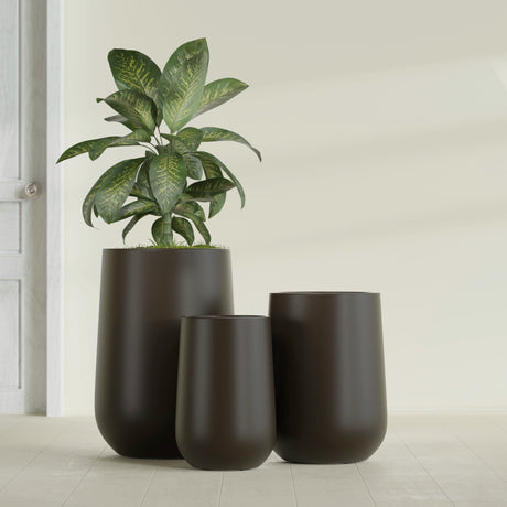 Hayden Urn fiberglass planter in Matte Dark Brown, size range, in a sunlit interior