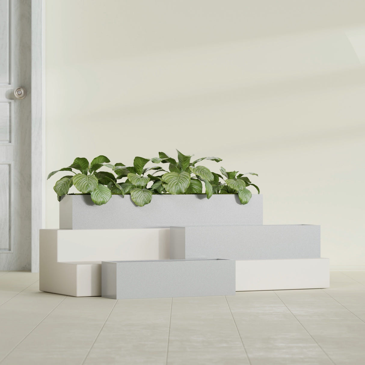 Monaco Rectangle fiberglass planter in Metallic Silver, shown planted, in a sunlit interior