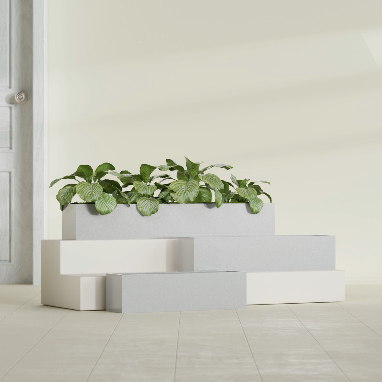 Monaco Rectangle fiberglass planter in Metallic Silver, shown planted, in a sunlit interior