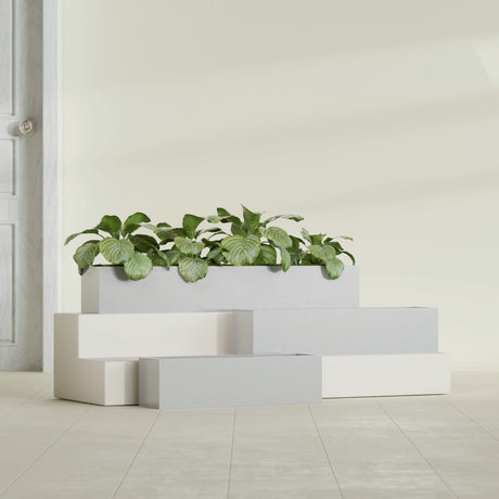 Monaco Rectangle fiberglass planter in Metallic Silver, shown planted, in a sunlit interior