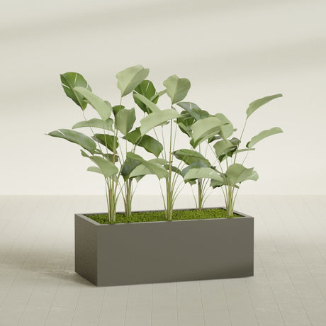 Torino Corner fiberglass planter in Matte Bronze, shown planted, in a sunlit interior