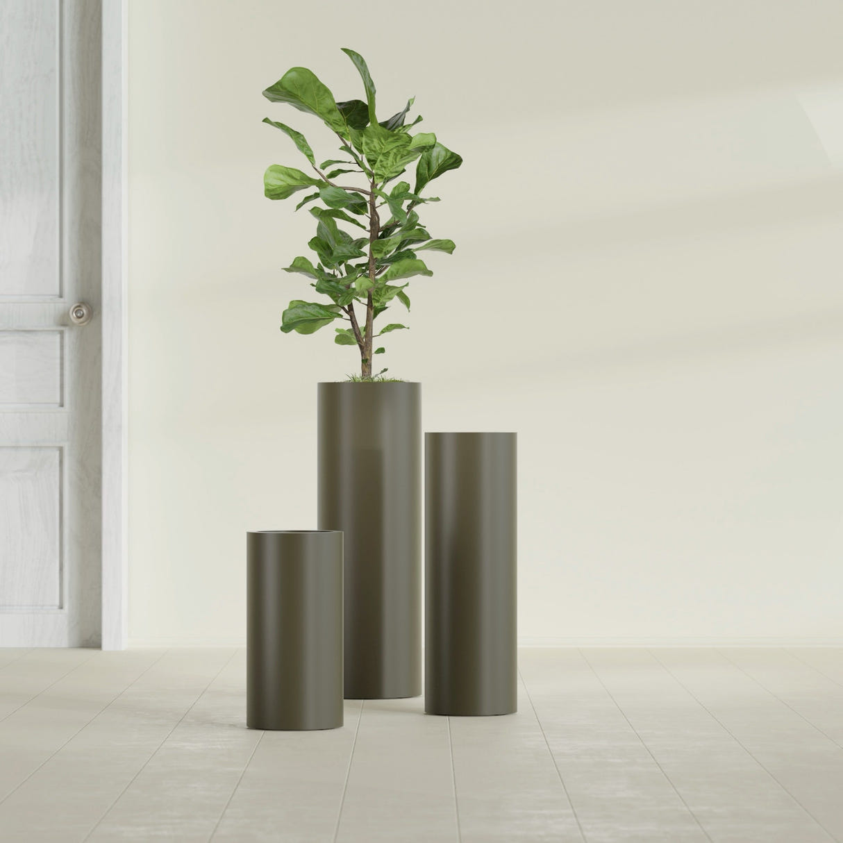 Corry Cylinder fiberglass planter in Matte Bronze, size range, in a sunlit interior