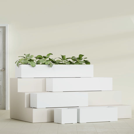 Cuba Low Rectangular fiberglass planter in Matte Bright White, size range, in a sunlit interior