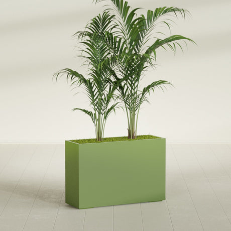 Potsdam Corner fiberglass planter in Satin Green, shown planted, in a sunlit interior