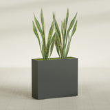 Perth Corner fiberglass planter in Matte Charcoal, shown planted, in a sunlit interior