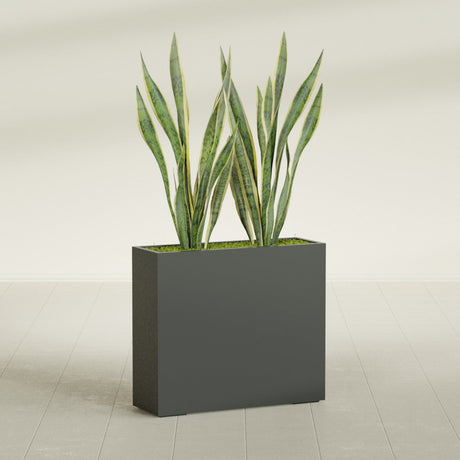 Perth Corner fiberglass planter in Matte Charcoal, shown planted, in a sunlit interior