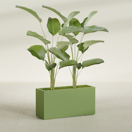 Tolga Corner fiberglass planter in Satin Green, shown planted, in a sunlit interior