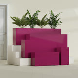 Hollywood Narrow Rectangular fiberglass planter in Gloss Eggplant, size range, in a sunlit interior