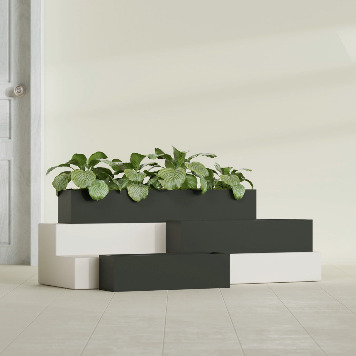 Monaco Rectangle fiberglass planter in Matte Charcoal, shown planted, in a sunlit interior