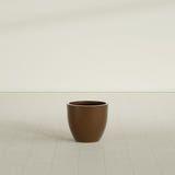 Wannsee Round Planter in Metallic Bronze, 22"D × 19"H, shown empty