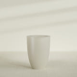 Brannan Tapered Round Planter in Satin Beige, 30"D × 41"H, shown empty