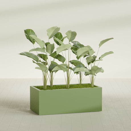 Torino Corner fiberglass planter in Satin Green, shown planted, in a sunlit interior