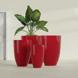 Brannan Tapered Round fiberglass planter in Gloss Red, size range, in a sunlit interior