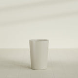 Tegel Round Tapered Planter in Satin Beige, 18"D × 26"H, shown empty