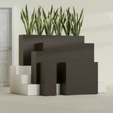 Delray Corner fiberglass planter in Matte Dark Brown, size range, in a sunlit interior