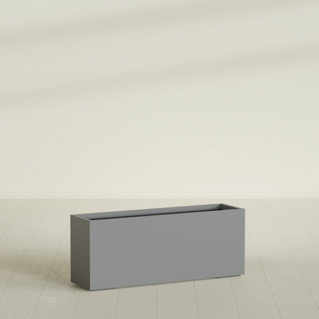 Tolga Rectangular Planter in Matte Gunmetal, 60"L × 16"D × 24"H, shown empty