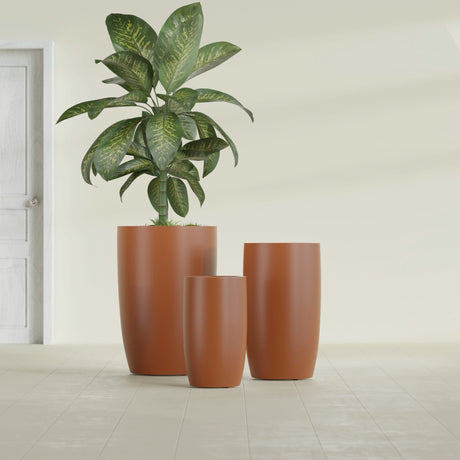 Lisbon Tall Round fiberglass planter in Matte Terra Cotta, size range, in a sunlit interior