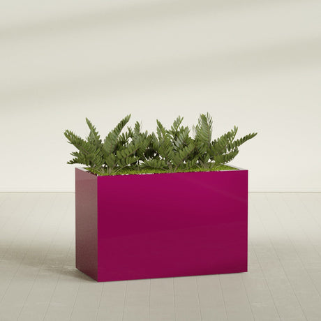Brisbane Corner fiberglass planter in Gloss Eggplant, shown planted, in a sunlit interior